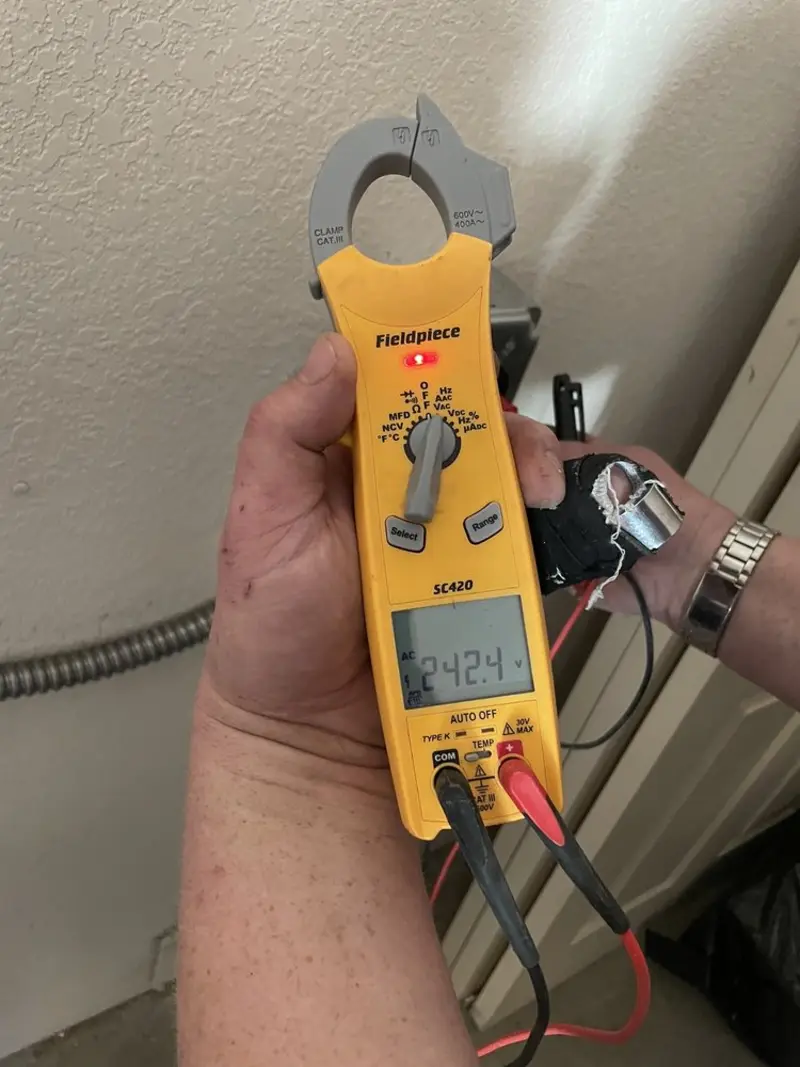 Voltage testing with clamp meter during Outlet Installation in Ault